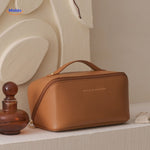 Orange leather-look cosmetic bag for travel storage