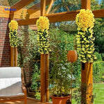 Artificial yellow orchid cascade with realistic tropical appearance.