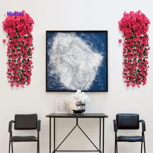 Artificial orchid flowers arranged in a stylish home display.