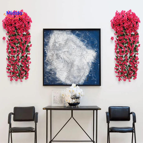 Artificial orchid flowers arranged in a stylish home display.