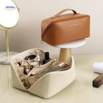 Organized light beige cosmetic pouch with compartments