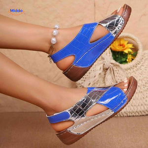 Glossy orthopedic women's sandals with cross strap for polished comfort support.