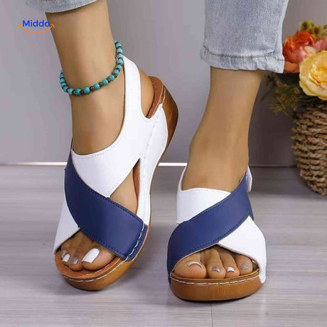 Orthopedic sandals with velcro strap for easy adjustable fit and cushioned support.
