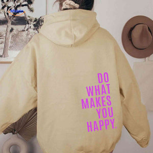 Beige oversized hoodie with pink graphic print.