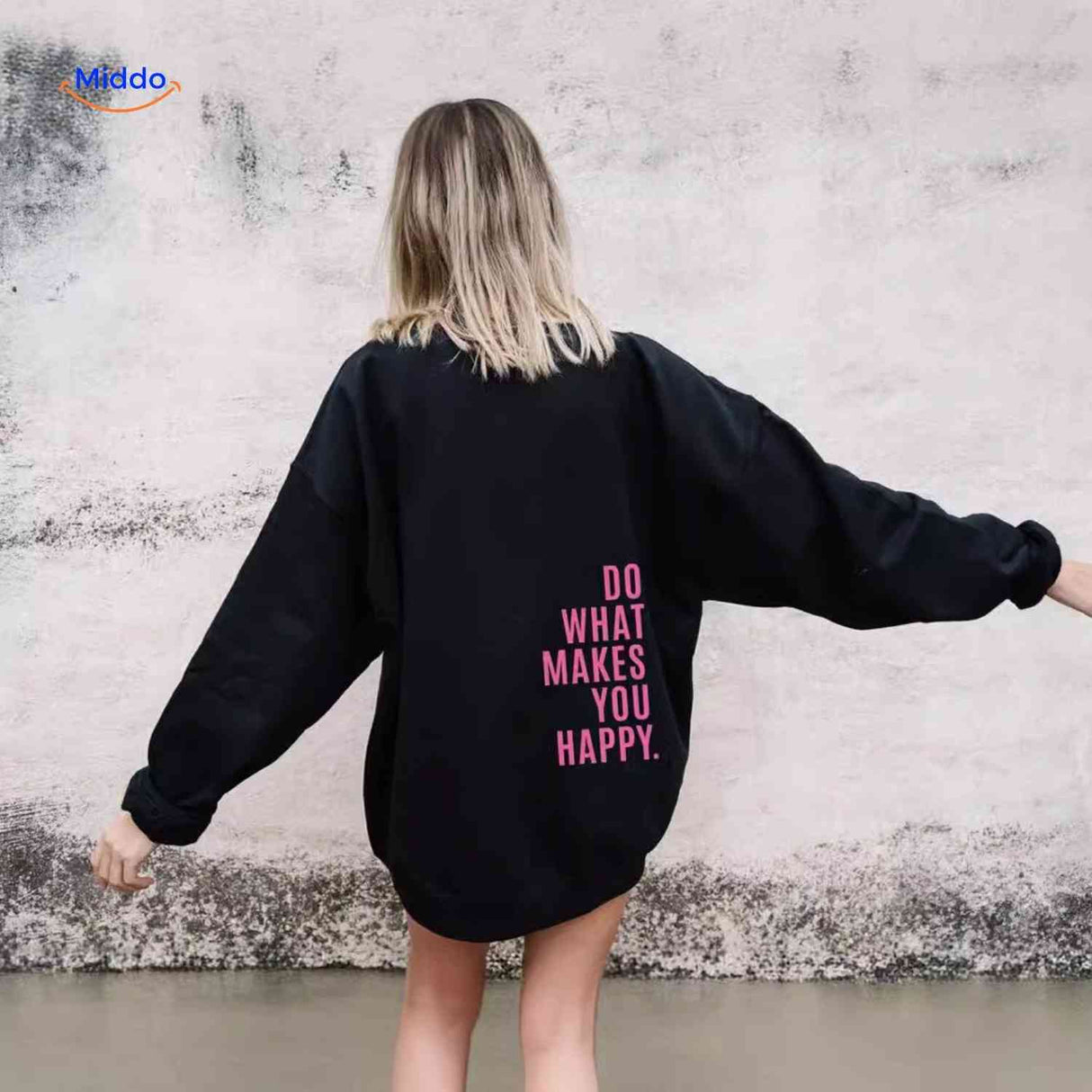 Black oversized hoodie with pink graphic design.