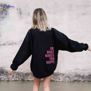 Black oversized hoodie with pink graphic design.