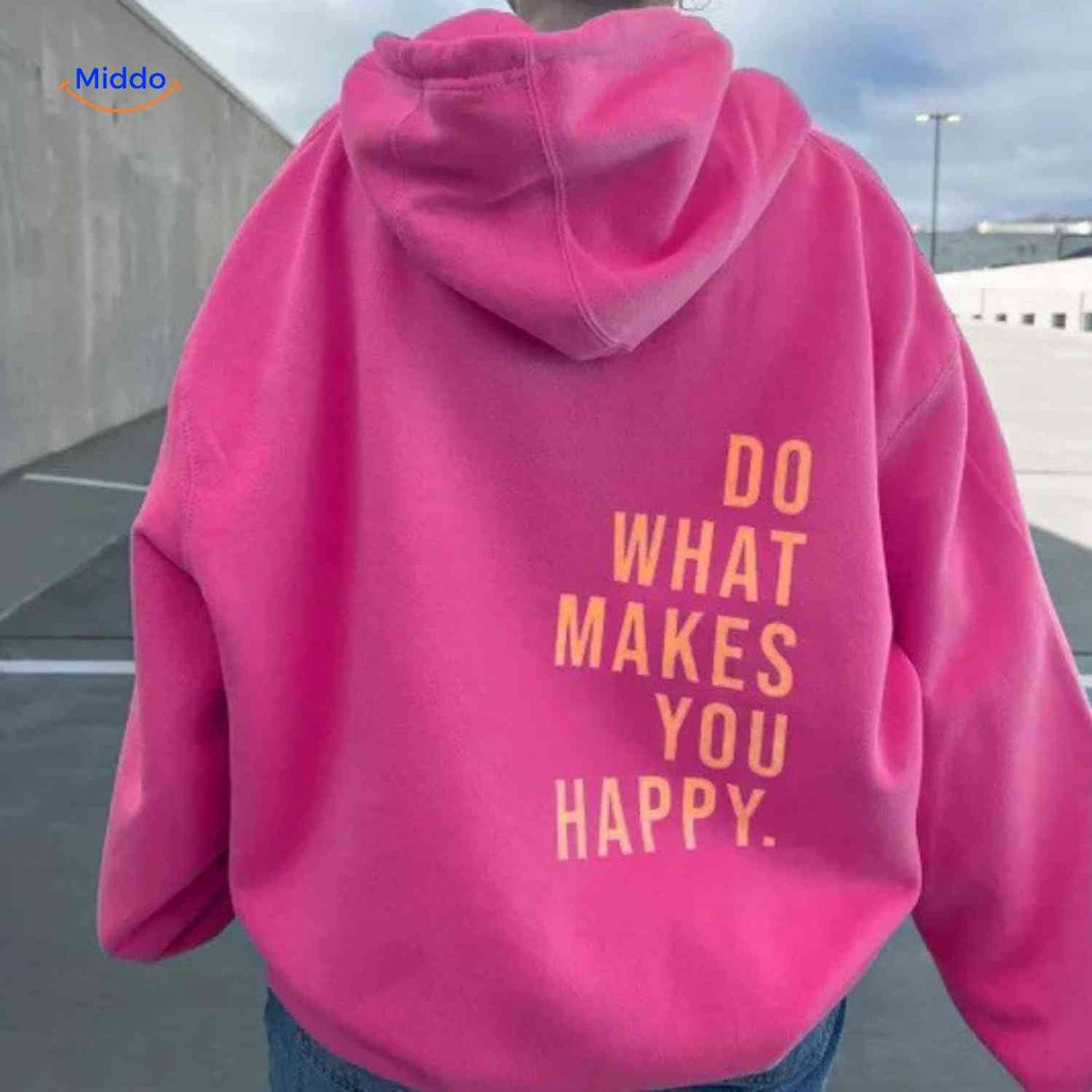 Dusty pink oversized hoodie with orange text detail.