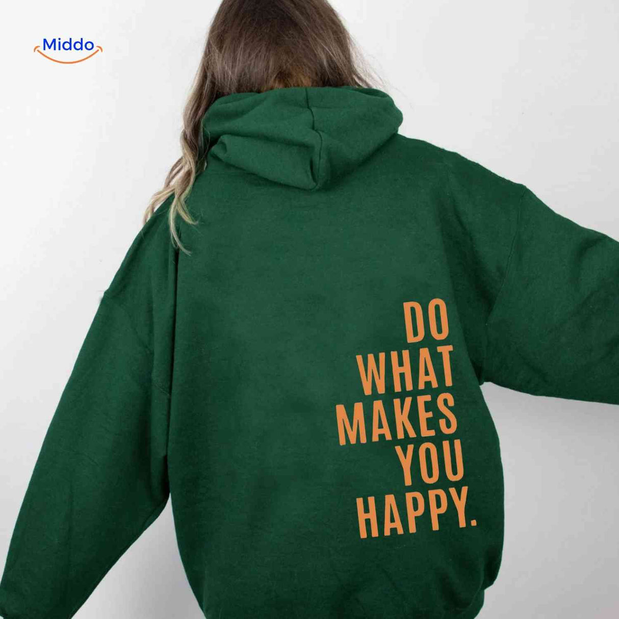 Green oversized hoodie with orange text detail.