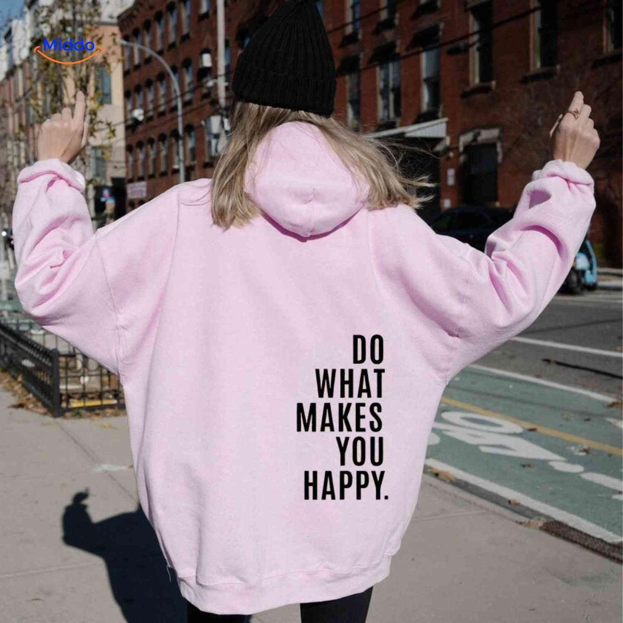 Pink oversized hoodie with black graphic detail.