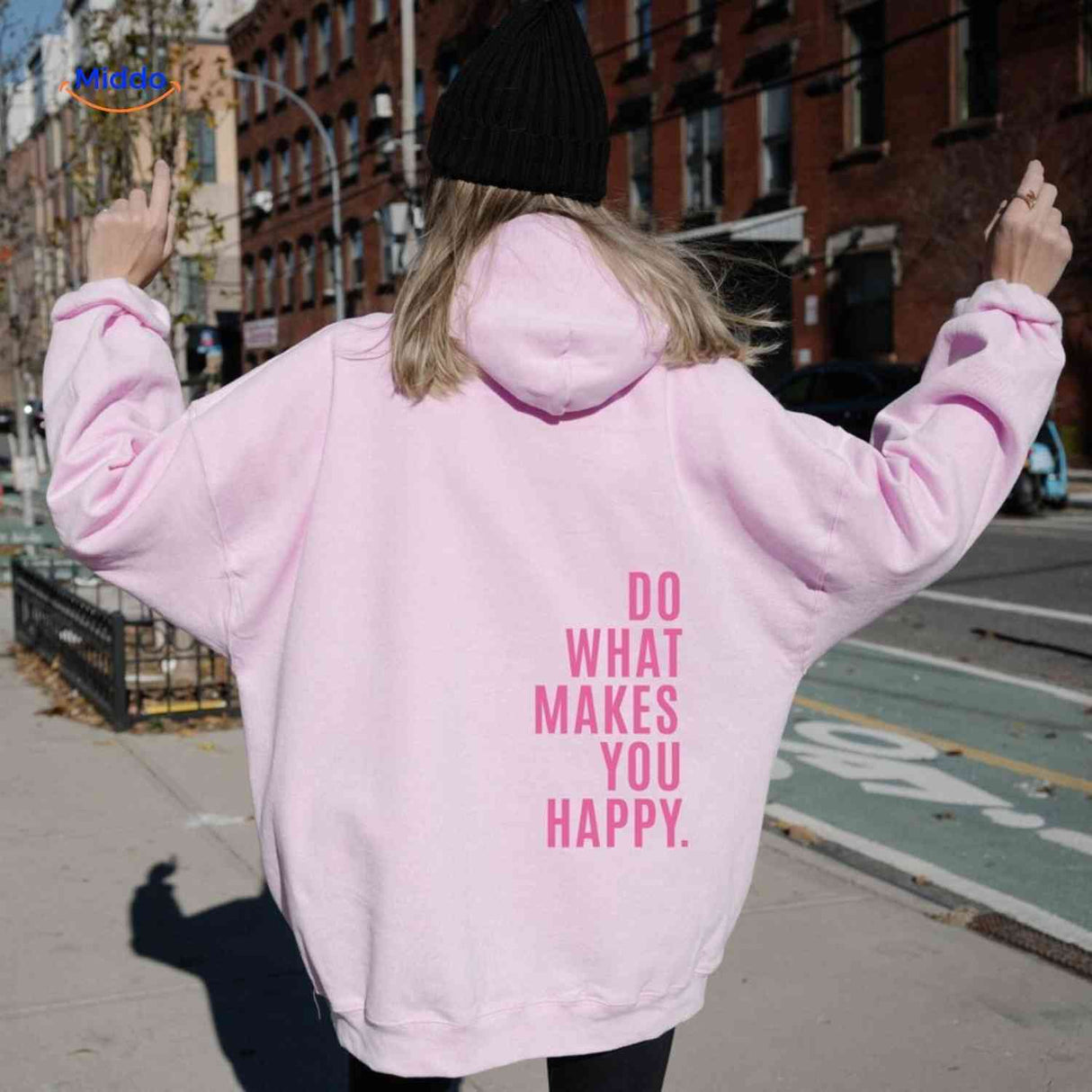 Pink oversized hoodie with tonal pink text print.
