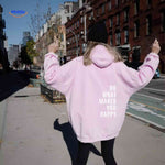 Pink oversized hoodie with white text design.