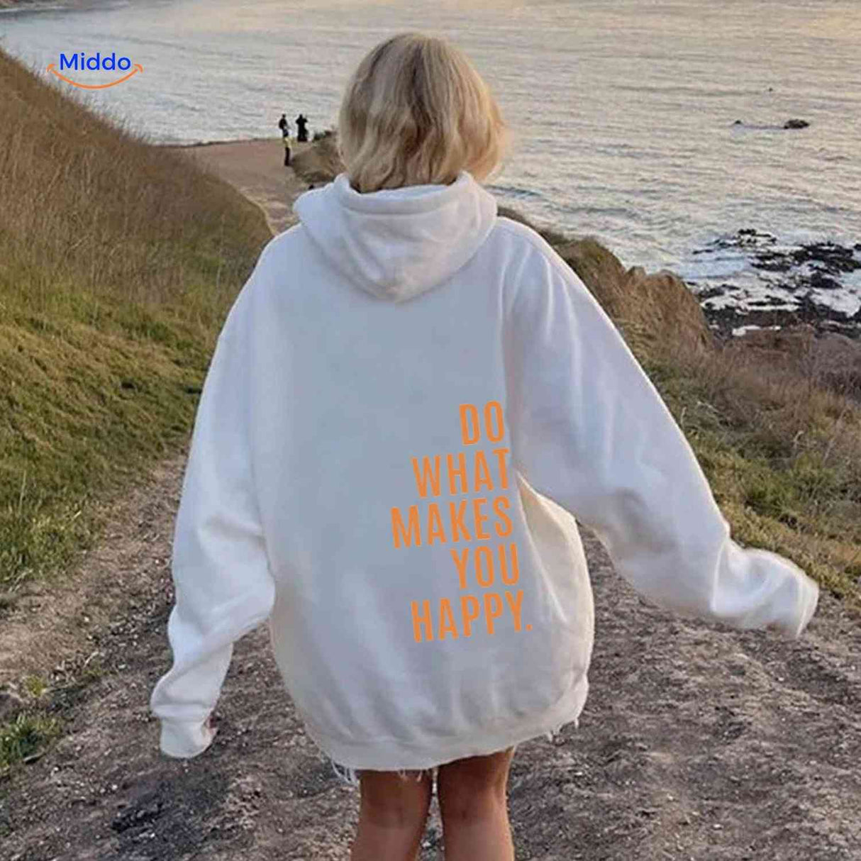 White oversized hoodie with orange motivational text.