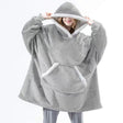 Oversized sherpa fleece hoodie styled for ultimate comfort and relaxation at home.