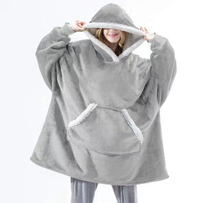 Oversized sherpa fleece hoodie styled for ultimate comfort and relaxation at home.