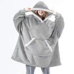 Oversized sherpa fleece hoodie styled for ultimate comfort and relaxation at home.