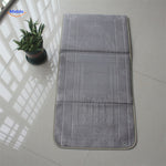 Compact padded travel prayer mat in grey, folded neatly for travel or outdoor use.