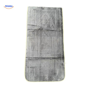 Compact padded travel prayer mat in light grey, neatly folded.
