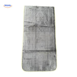 Compact padded travel prayer mat in light grey, neatly folded.