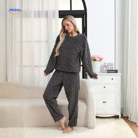 Pink pajama set with cherry print pattern, perfect winter loungewear.