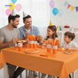 Complete PartyLux party tableware set displayed on a birthday table with plates, cups, and cutlery.