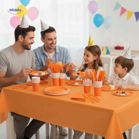 Complete PartyLux party tableware set displayed on a birthday table with plates, cups, and cutlery.