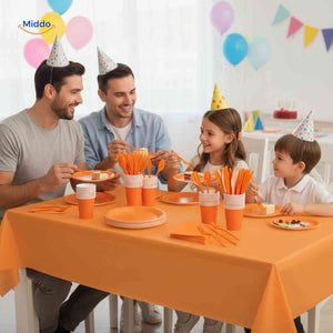 Complete PartyLux party tableware set displayed on a birthday table with plates, cups, and cutlery.