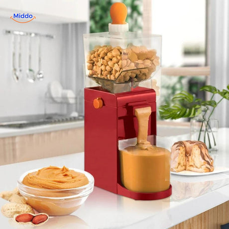 Side view of electric peanut butter maker during operation.