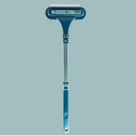 MultiBrush pet hair remover brush in blue with integrated rubber squeegee strip.
