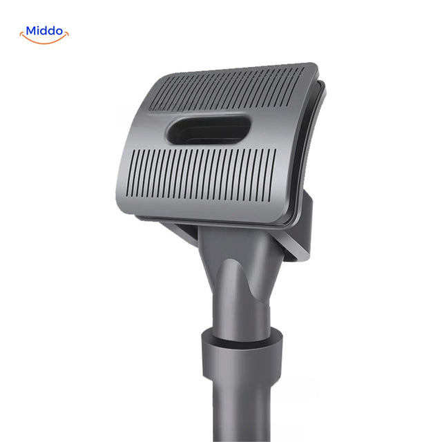 Pet hair brush with vacuum nozzle attachment for dog grooming.