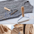 Pet hair remover brush effectively lifting fur from clothing and fabric.