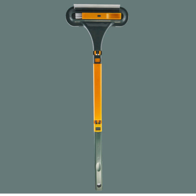 MultiBrush pet hair remover with soft rubber strip in orange color for effective cleaning.