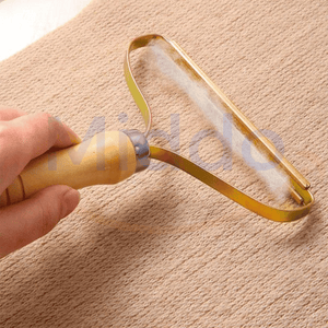 Pet hair remover brush for removing pet fur and lint efficiently.