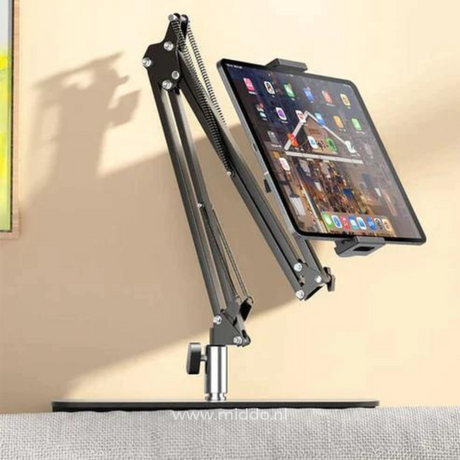 FlexArm phone holder positioned at desk for ergonomic work posture.
