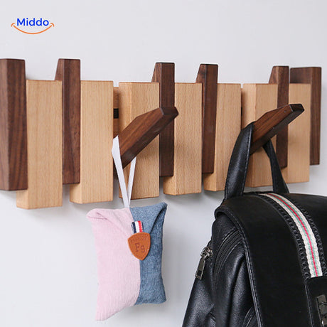 Piano coat rack hanging system displaying bags with foldable hooks fully extended.