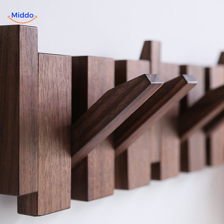 Modern piano coat rack design in handmade wood with minimalist architectural appeal.