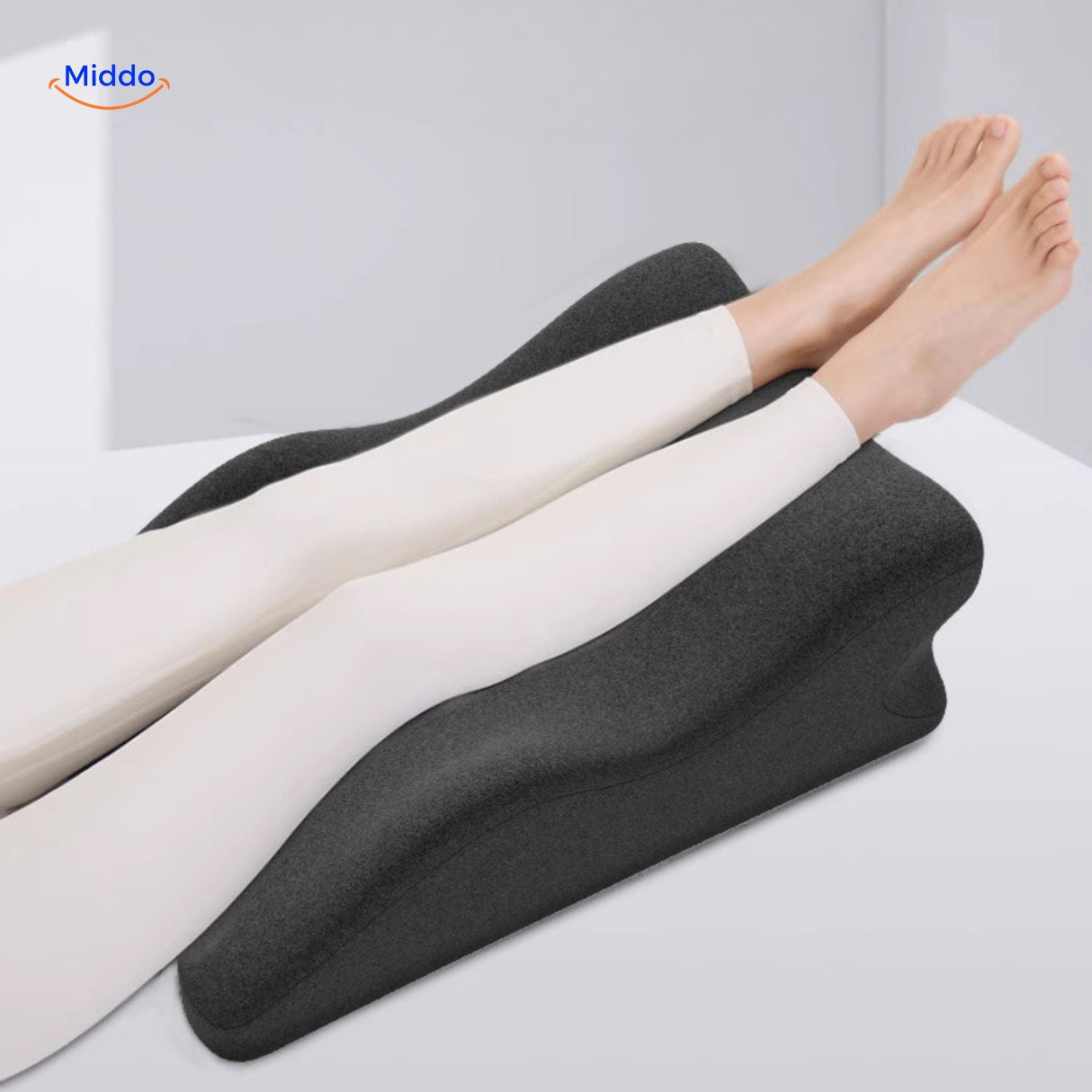 Leg elevation pillow providing full body relaxation and therapeutic comfort support.