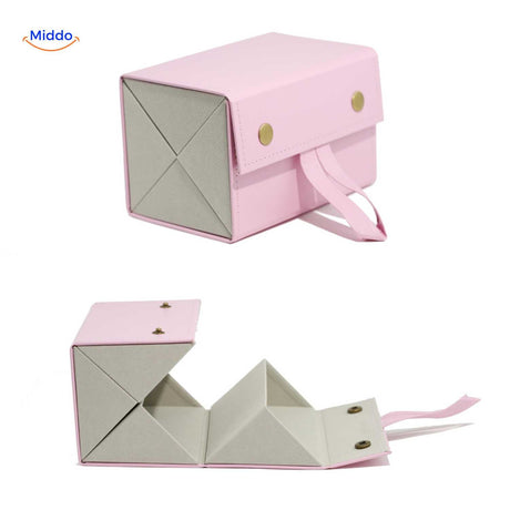Pink 4-slot compact foldable eyeglasses holder displayed open with four individual slots.