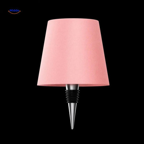 Pink rechargeable dimmable bottle lamp for playful ambient decor lighting.