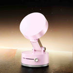 Pink magnetic phone stand for stylish desk or table display.