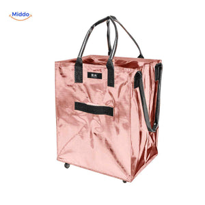 Pink metallic foldable shopping trolley with wheels and adjustable straps