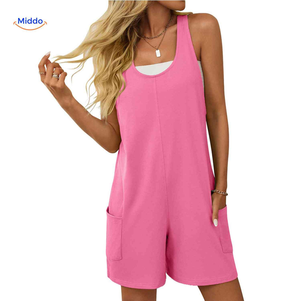 Pink open-back romper with comfortable fit and practical pocket storage.
