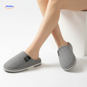 Pink cotton slippers with soft lining and slip-resistant sole.