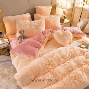 Salmon pink teddy fleece bedding set with soft texture and heart-shaped pillow gift