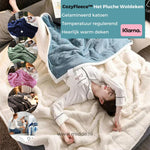 Plush wool blanket draped comfortably over a sleeping person for warmth.