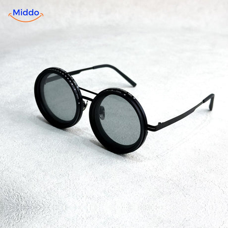 Black sunglasses with premium metal frame and polarized UV lens coating.
