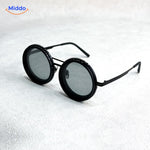 Black sunglasses with premium metal frame and polarized UV lens coating.