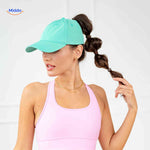Mint green ponytail cap with high opening, sporty and casual style.