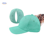 Mint green ponytail cap with hair opening, light and sporty for active wear.