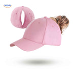 Pink ponytail cap with hair opening for sporty summer style and activities.