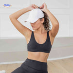 White ponytail cap with high hair opening, perfect for fitness and active wear.